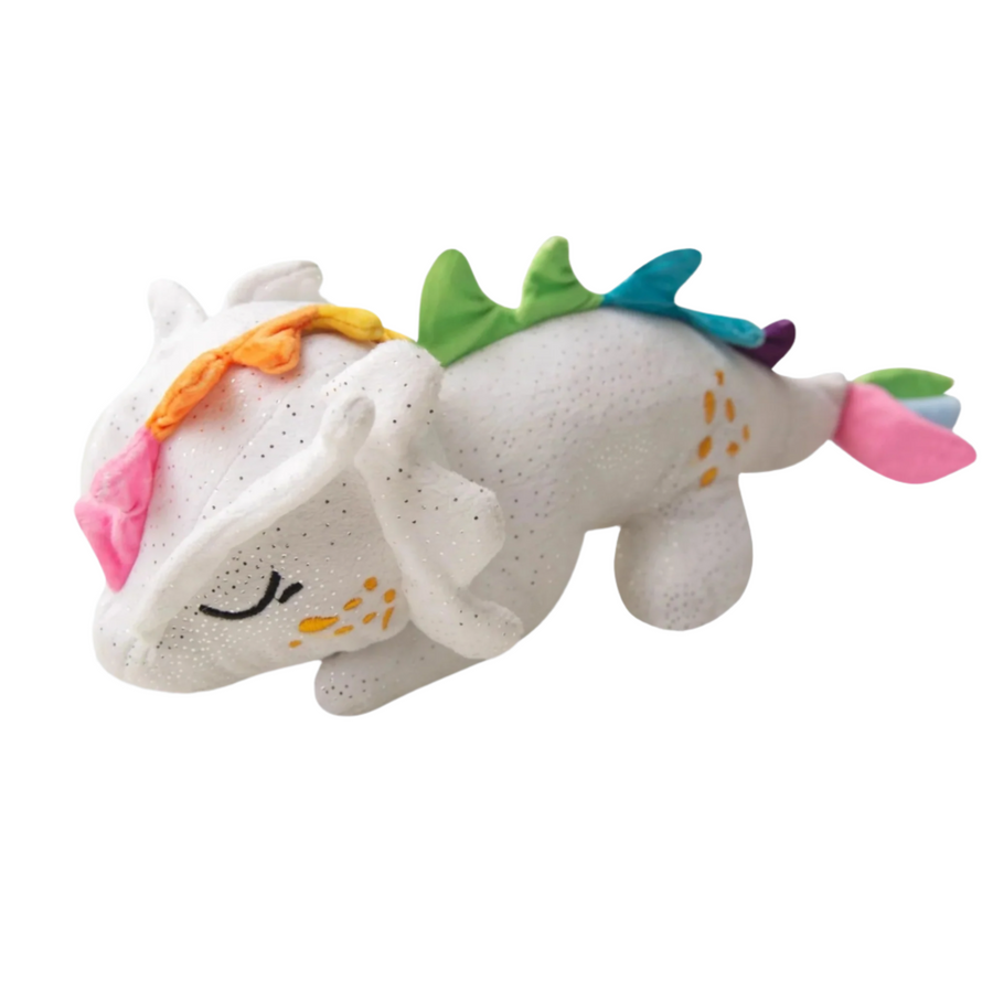 Soft and cuddly dragon plush toy with colorful details on white wooden background