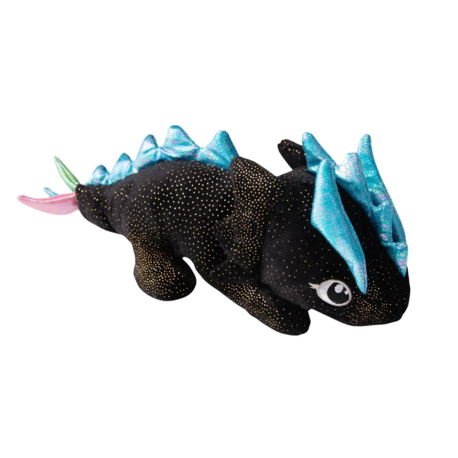 Charming black and blue plush dragon dog toy with speckled details, resting on a white wooden surface.